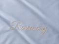 Embroidered name 'Rosemary' on a light blue sateen cotton sheet